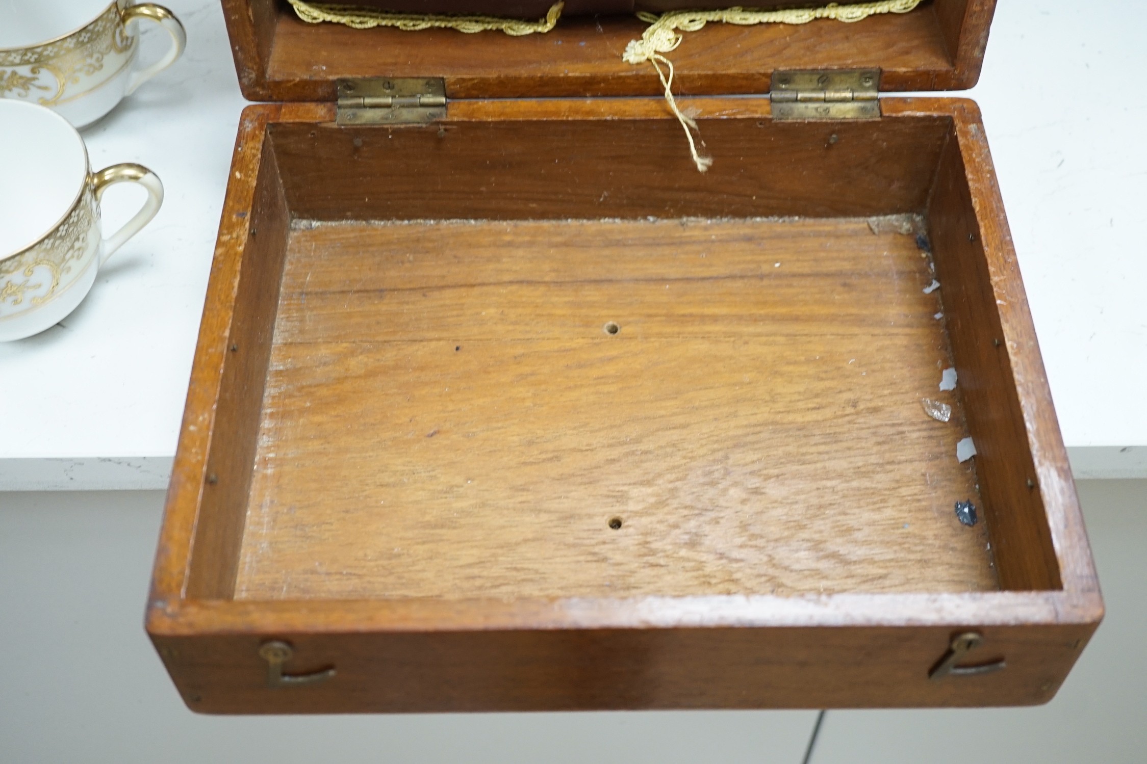 A Victorian boxwood strung burr yew sarcophagus shaped tea caddy, another mahogany tea caddy, a brass bound mahogany silver box with Bramah lock and another mahogany box. Largest 40cm wide